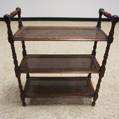 1219	DIMINUATIVE OAK 3 TIER STAND WITH CANE SHELVING, APPROXIMATELY 11 IN X 25 IN X 30 IN
