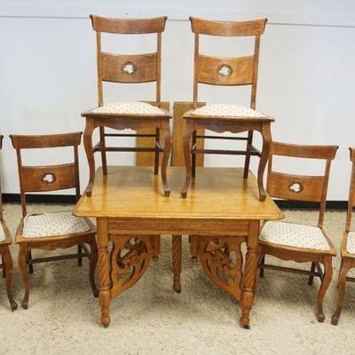 1291	ANTIQUE SQUARE OAK TABLE W/LION HEAD STRETCHER & 6 CHAIRS, 2 LEAVES, SOME STAINING ON SEATS, TABLE APPROXIMATELY 36 IN X 42 IN,...