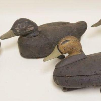 1073	LOT OF 4 CORK BODY DUCK DECOYS, LARGEST APPROXIMATELY 15 IN X 8 IN X 6 IN
