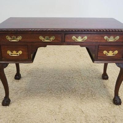 1208	MAHOGANY DESK WITH 4 DRAWERS ON CABRIOLE BALL AND CLAW FOOT LEGS AND REEDED QUARTER COLUMN SIDES, APPROXIMATELY 47 IN X 22 IN X 31...