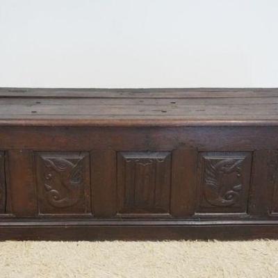 1212	ANTIQUECONTENTIAL  OAK CARVED LIFT TOP BENCH WITH CARVED FOLDED LINEN PANELS AND DOULPHINS, APPROXIMATELY 67 IN X 20 IN X 32 IN
