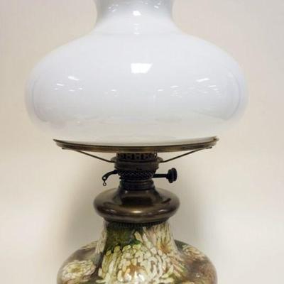 1104	ANTIQUE ART POTTERY KEROSENE LAMP, APPROXIMATELY 22 IN H, LAMP HAS BEEN ELECTRIFIED
