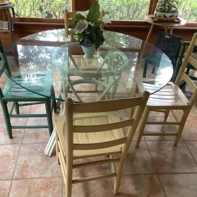 $199 Rattan table with glass top and 4 wooden chairs 48