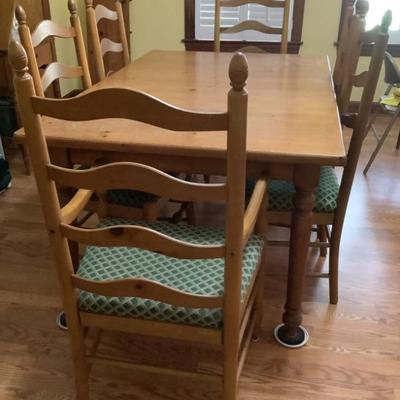 $389 Knotted pine table with 6 chairs/2 captains 30"H 62"L 40"W -2 leaves12" each 