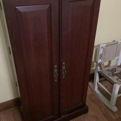 $54 storage cabinet double doors with shelves/storage to store on doors & inside 44"H 23"W 14'Depth
