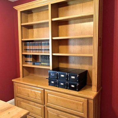 Quality oak double bookcase with drawers and adjustable shelves.