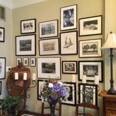 Framed black and white photos and drawings
