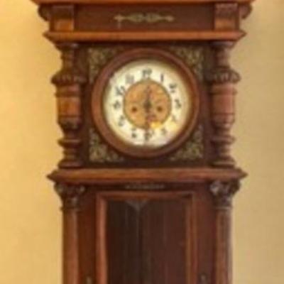 This Antique Gustav Becker Clock is absolutely stunning and features multiple intricate details and elegant brass accents.

Measures 53 x...