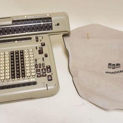 1107	SCM MARCHANT ADDING MACHINE CALCULATOR, APPROXIMATELY 19 IN X 15 IN X 9 IN HIGH
