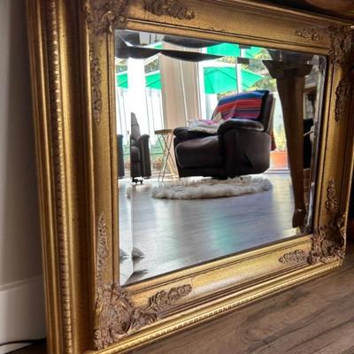 Beatiful scrollwork gilded mirror. One of several. 