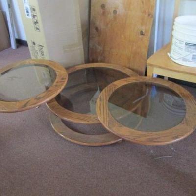 milo style wood swivel coffee occasional table.  smoked glass
