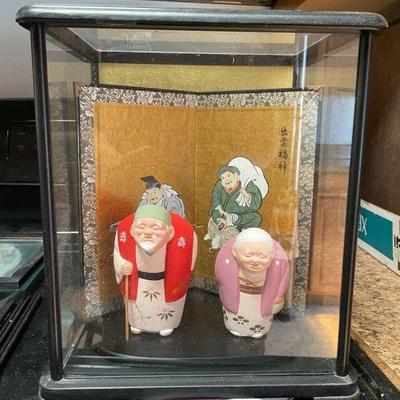 PCT079- Ceramic Figurines - Obaasan & Ojiisan in Glass Case w/Scroll Screen
