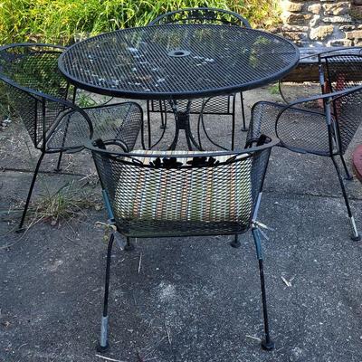 3 different metal  patio table and chairs sets. 2 black. One white.