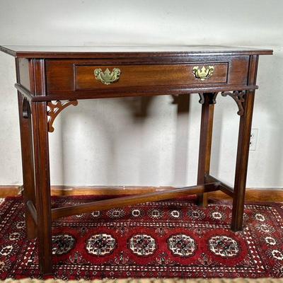 COUNCILL CRAFTSMEN CHIPPENDALE SIDE TABLE | Mahogany side table. Central drawer with two brass pulls and H-stretcher. Constructed of...