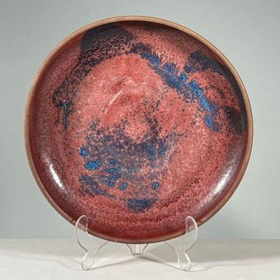 RICK CROWN GLAZED PLATTER | Large circular platter with red glaze and dotted blue spots, signed Rick Crown on bottom. - h. 3 x dia. 16 in 