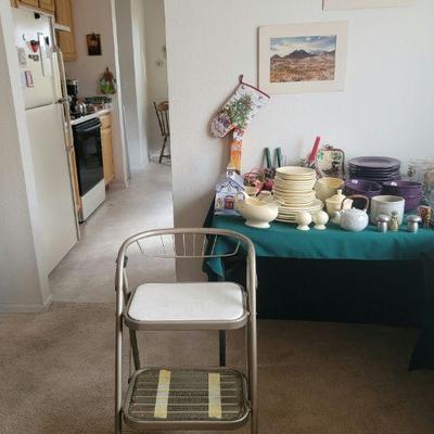 Old stepping stool and several sets of serving dishes