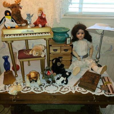 Toy piano and needle point bench