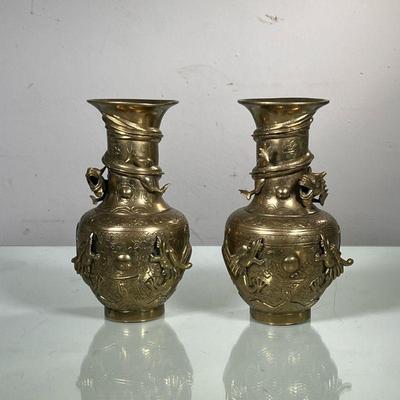 (2PC) PAIR CHINESE BRASS VASES | Decorated with swirling dragon relief spiraling around vase with etched flora and fauna decoration. - h....