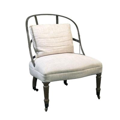 RESTORATION HARDWARE COUTURIER'S CHAIR | Metal-backed chair with riveted supports atop a cream-colored cushion with turned wooden legs...