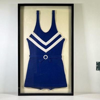 FRAMED ANTIQUE WOMANâ€™S BATHING SUIT | Navy blue with white stripes antique womenâ€™s bathing suit in large black frame. - l. 21.5 x h....