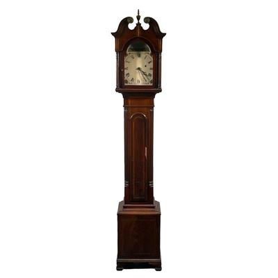 GRANDMOTHER CLOCK | Grandmother clock with intricate wooden inlay and metal medallions on top, showing man on horse riding across...