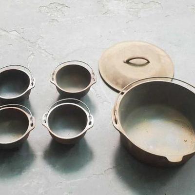#601 â€¢ (4) Cast Iron Bowls & Cast Iron Pot With Lid
