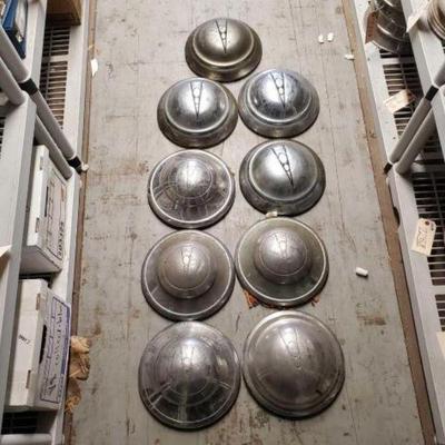#7518 â€¢ (9) V8 Vintage Hubcaps
