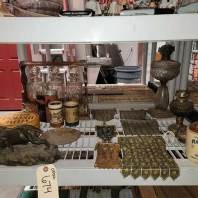 #674 â€¢ Lion Statue, Glass Bittles, Lamps & Coin Bags
