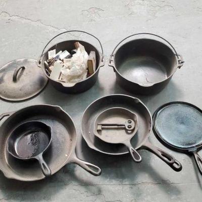 #600 â€¢ (2) Cast Iron Pots & (6) Cast Iron Pans
