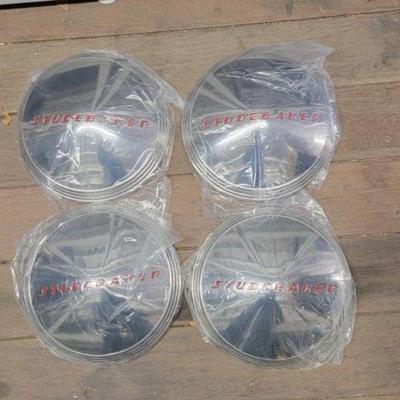 #7500 â€¢ (4) Studebaker Hubcaps

