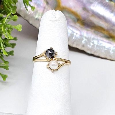 Small Ring (Size 4) 14k Yellow Gold Featuring Two Cultured Pearls, One White one Black each 4.2 mm