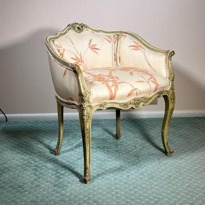 FRENCH CARVED SLIPPER ARMCHAIR | Carved wood frame with curved back leading to pink rose cushions on carved wood legs. - l. 24.5 x w. 19...