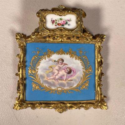 ANTIQUE BRASS CARD WRITING TRAY | More research into this needed Showing small painted scene of 2 cupids with gilt border and flip-top...