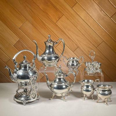 (7PC) SILVER PLATE TEA & COFFEE SET | Silver plate on copper tea set including; Hot water kettle with oil heater and stand, coffee and...