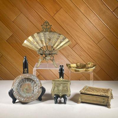 (5PC) MISC. BRASS LOT | Includes; engraved brass fan, small floral easel, shield-shaped brass container with floral engraving and open...