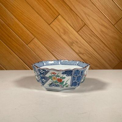 TIFFANY & CO. PAINTED BOWL | Octagonal bowl showing 4 floral scenes divided by blue and white cross-hatched and hexagonal patterns. - l....