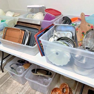 Plenty of plastic food storage containers as well as pans, etc.