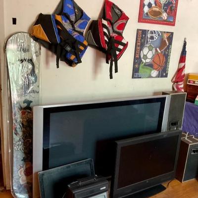 TVs, monitor, life jackets, snowboard.