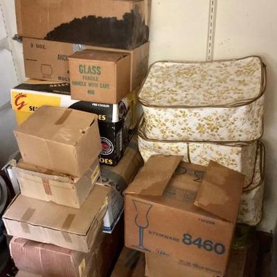 Boxes full of various styles of drinking glasses - never used!