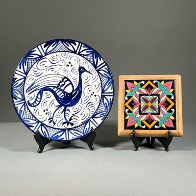(2PC) DECORATIVE CERAMICS | A colorful decorative tile in wood frame with a geometric floral design in red, black, pink, orange, and...
