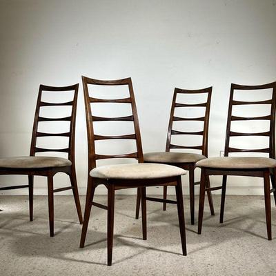 (4PC) MID-CENTURY ROSEWOOD DINING CHAIRS | Four rosewood dining chairs in dark wood, featuring cream cushions and carved rosewood...