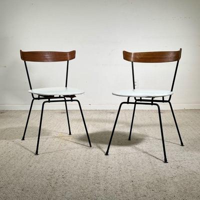 (2PC) MID-CENTURY KITCHEN CHAIRS | Two stylish chairs constructed on a metal frame with curved wooden backings and white seat cushions. -...