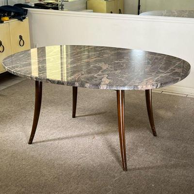 CUSTOM MID-CENTURY DINING TABLE | Glossy dining table; custom-built stone top with spindle legs in shiny dark wood. - l. 61.5 x w. 48 x...