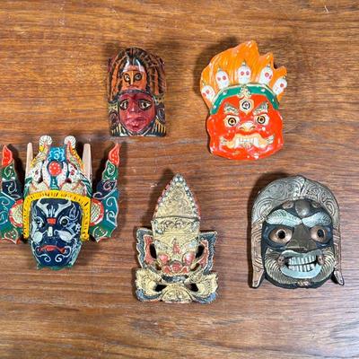 (5PC) SMALL COLORFUL MASKS LOT | Includes four hand carved wooden masks and one Mongolian ceramic mask of various styles and origins. -...