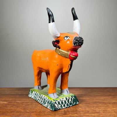 HAND PAINTED CERAMIC BULL | Hand made and hand painted ceramic bull statue, initialed â€œJCâ€ on bottom. - l. 1 x w. 4.5 x h. 11 in 