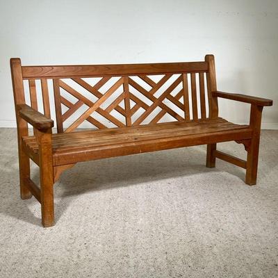 MID-CENTURY WOODEN BENCH | Beautifully made slatted wooden park bench with a wide armrest and a geometric, crosshatched wooden back. Made...