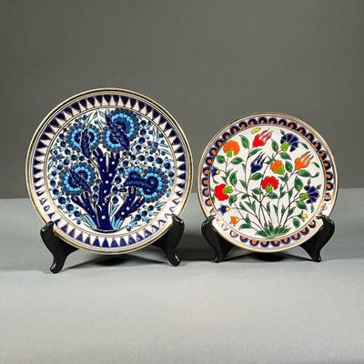 (2PC) COLORFUL HAND MADE GILT PLATES | Includes colorful floral plate with gilt accents and border and a similarly decorated blue plate....