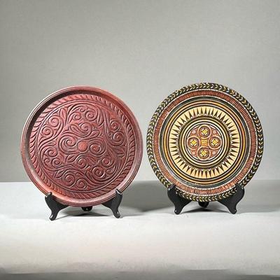 (2PC) CARVED WOODEN PLATES | Two hand carved plates, one with paint decoration. Intricate, swirling designs. - l. 10 x h. 16 in (largest) 