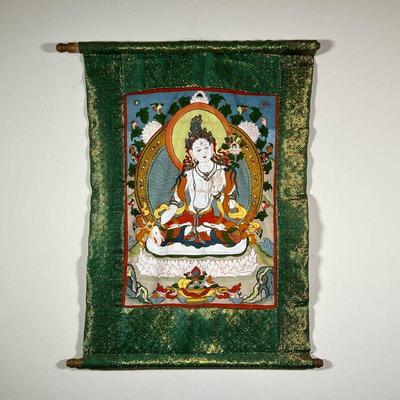 THANGKA PAINTING | Buddhist Thangka scroll painting featuring a seated figure surrounded by lotus flowers, mounted on green and gold...