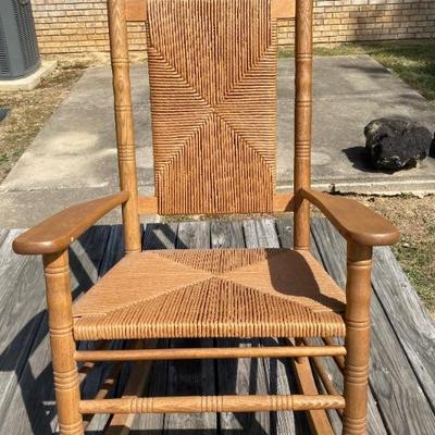 Woven reed rocking chair.